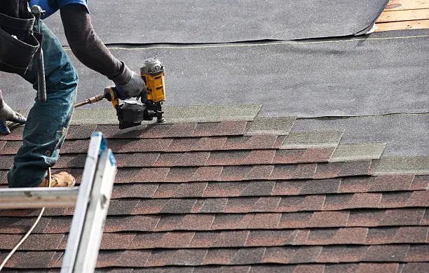 Roofer on the job